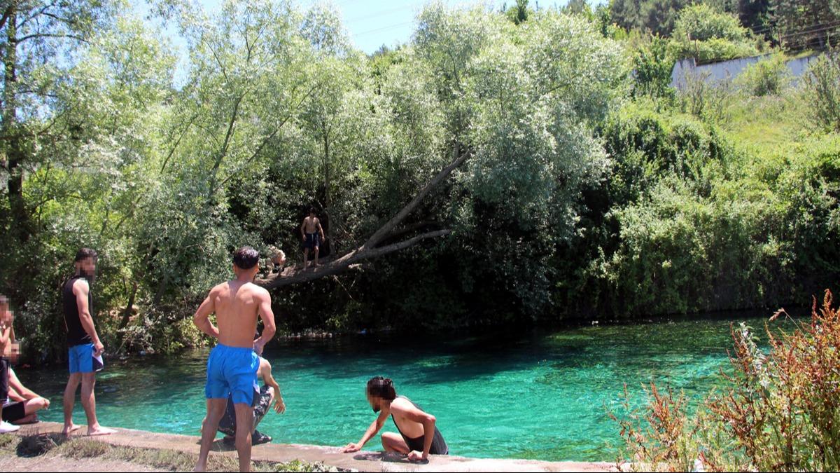 Girilmesi yasak olan barajda yzen 13 kiiye 26 bin lira ceza kesildi