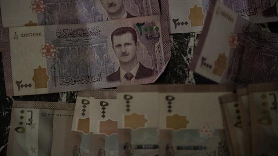 Suriye'de para birimi de�i�iyor... Yeni banknotlar tedav�le girdi