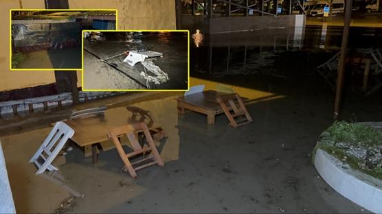 Kenti ikiye bölen ırmak taştı: İş yerleri sular altında