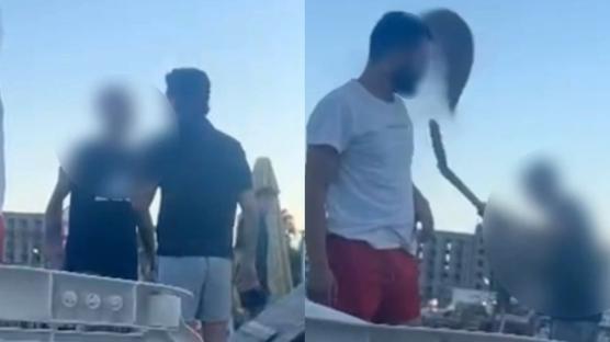 Plajda skandal g�r�nt�! Gen�leri kum f�rlatarak uzakla�t�rd�lar