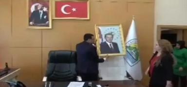 DEM'li bakan Erdoan'n resmini indirdi