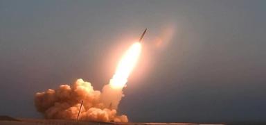 Kuzey Kore'den askeri gerilimi art�racak bir hamle! 10 top�u roketi f�rlatt�